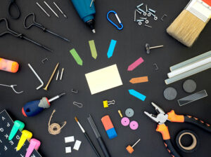 Flat lay of office supplies and tools